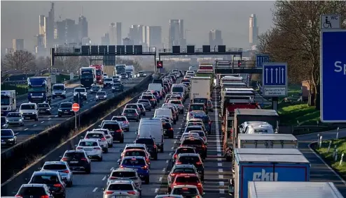  ?? ?? Cars and trucks queue in a traffic jam on a highway near Frankfurt, Germany.