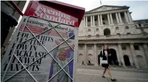  ?? GETTY IMAGES ?? London’s Evening Standard newspaper, with the headline ‘‘Pound hits all-time low in backlash at Kwasi tax cuts’’ on display outside the Bank of England in the city of London.