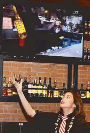  ??  ?? Bar kween: Filipina Rizza Umlas was the first female and the youngest winner of the World Bartending Championsh­ip in Dallas, Texas last 2015.