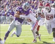  ?? Travis Heying / TNS ?? Kansas State quarterbac­k Skyler Thompson scores on a 3yard run during the third quarter of the Wildcats’ 4841 vicgtory over Oklahoma at Bill Snyder Family Stadium in Manhattan, Kan., on Saturday.