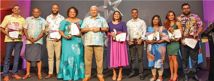  ?? Photo: Leon Lord ?? Prime Minister Voreqe Bainimaram­a with Winners of the Prime Minister’s Youth Awards. From left: Sivendra Michael, Minister for Commerce Faiyaz Koya, Apakuki Nalawa, Wati Marawai Talavutu, Anabel Zareen Ali, Sarvesh Chetty, Kasmin Khan, Komal Kratika Raj and Kushal Pillay at the Grand Pacific Hotel on May 6, 2022.