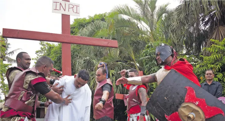  ?? Photo: Ronald Kumar ?? Pacific Regional Seminary students following the Easter crucifixio­n drama in Nasese , Suva on April 2, 2021.