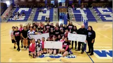  ?? COURTESY ?? TOP RIGHT: The Questa Ladycats volleyball team pose with checks that will help out local cancer heroes, Gloria Segura, Martha Sanchez and Johnny Gonzales.