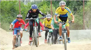  ??  ?? Kashmiri boys ride bikes in Srinagar during a sports event. — H. U. Naqash