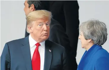  ?? /AFP ?? Demanding: US President Donald Trump and Britain’s Prime Minister Theresa May speak at the North Atlantic Treaty Organisati­on (Nato) summit in Brussels on Wednesday. Trump is demanding that Nato allies ‘reimburse’ Washington for the cost of defending the continent.