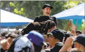  ?? Myung J. Chun Los Angeles Times ?? A FAN body-surfs during Cuco’s Grand Park party.