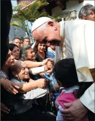  ?? ABACA PRESS/TNS ?? Pope Francis, center, greets people in Lima, Peru on Sunday.