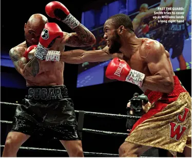  ?? Photo: CHRIS FARINA/MAYWEATHER PROMOTIONS ?? PAST THE GUARD: Smith tries to cover up as Williams lands a long right hand