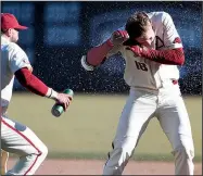  ?? NWA Democrat-Gazette/J.T. WAMPLER ?? Arkansas right-fielder Heston Kjerstad gets doused with water after hitting a walk-off single, scoring Curtis Washington in the ninth inning to beat Eastern Illinois 3-2 on Sunday at Baum-Walker Stadium in Fayettevil­le.