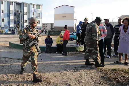  ?? PICTURE: LEON LESTRADE/AFRICAN NEWS AGENCY (ANA) ?? LAW AND ORDER: Police, metro police and the army operating in Grassy Park. The first effect of deploying the army in places rocked by civil unrest is a sudden drop in street crime, says the writer.