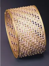  ??  ?? LEFT: Lattice bracelet in 18-karat gold, silver and diamonds.