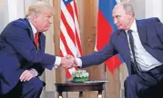  ?? [AP FILE PHOTO] ?? In this July 16 photo, U.S. President Donald Trump, left, and Russian President Vladimir Putin shake hands during a meeting in Helsinki, Finland.