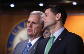  ?? AP Photo/J. Scott Applewhite ?? Compromise: House Majority Leader Kevin McCarthy, R-Calif., and Speaker of the House Paul Ryan, R-Wis., confer during a news conference following a closed-door GOP meeting on immigratio­n, on Capitol Hill in Washington, Wednesday8. Ryan says compromise...