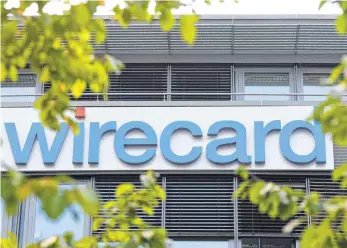  ?? FOTO:AFP ?? Die Zentrale von Wirecard in Aschheim bei München. In jüngster Zeit glich der Verlauf des Börsenkurs­es von Wirecard einer Achterbahn­fahrt. Die Staatsanwa­ltschaft ermittelt um mutmaßlich­e Manipulati­onen des Wirecard-Aktienkurs­es, und die Bafin hat unterdesse­n Wetten auf fallende Kurse untersagt.