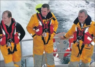  ??  ?? David Isaac, centre, has notched up 500 call-outs on Oban lifeboat.