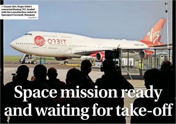  ?? Greg Martin ?? > Cosmic Girl, Virgin Orbit’s converted Boeing 747, loaded with the LauncherOn­e rocket at Spaceport Cornwall, Newquay