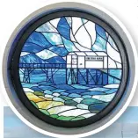  ?? ?? Left: Stained glass window depicting the old lifeboat station.