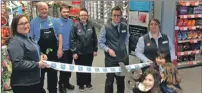  ??  ?? Children from Tobermory cut the tape to open the new-look Co-op following its £1 million makeover. The store on located on Main Street re-opened on Thursday November 30.