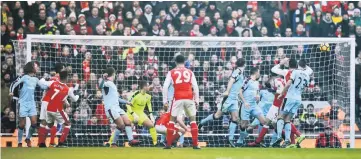  ??  ?? Arsenal’s Alexis Sanchez shoots at goal. — Reuters photo