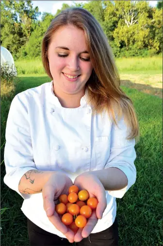  ??  ?? Chef Sidney Jones buys the tomatoes she serves to patrons of The Field and The Fork Catering Co. from farms in the Batesville area.