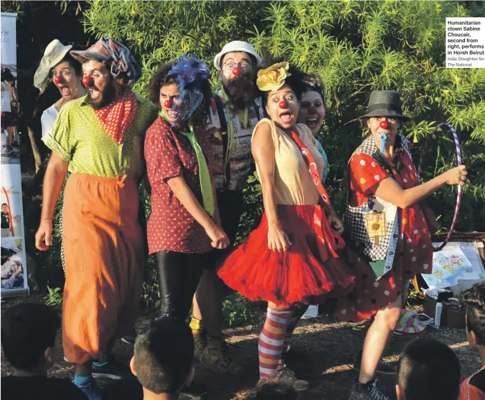  ?? India Stoughton for The National ?? Humanitari­an clown Sabine Choucair, second from right, performs in Horsh Beirut