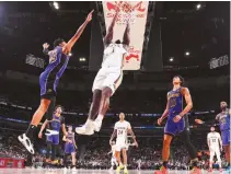  ?? NBA.COM ?? ZION WILLIAMSON #1 of the New Orleans Pelicans goes to the basket vs the Lakers.