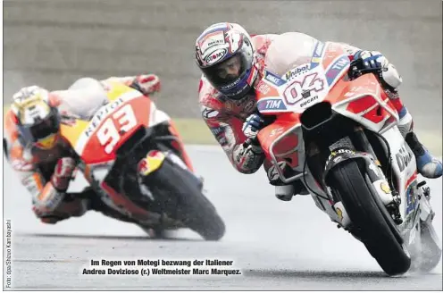  ??  ?? Im Regen von Motegi bezwang der Italiener Andrea Dovizioso (r.) Weltmeiste­r Marc Marquez.