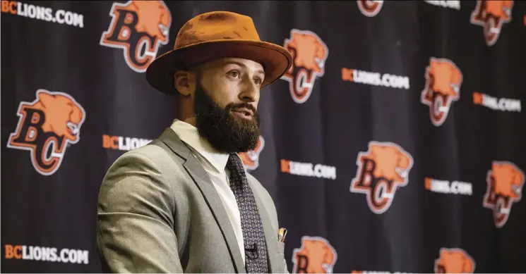  ?? Darryl dyck/The canadian Press ?? Quarterbac­k Mike Reilly speaks to the media after agreeing to a four-year contract with the B.C. Lions on Tuesday, the opening day of CFL free agency.