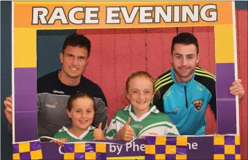  ??  ?? Leah Reck and Karen Hayden with Wexford hurlers Paul Morris and Eoin Moore at the Wexford G.A.A. Supporters’ Club race night on Thursday.