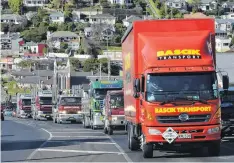  ??  ?? In low gear . . . The convoy grinds up Taieri Rd towards Three Mile Hill.