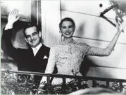  ?? ASSOCIATED PRESS ?? Prince Rainier III and Princess Grace Kelly wave from the Monaco palace terrace after their civil wedding ceremony.