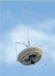  ?? Photo: REUTERS ?? Experiment­al design: A saucer-shaped test vehicle, which holds equipment for landing large payloads on Mars, is lifted up by a high-altitude balloon at the US Navy’s Pacific Missile Range Facility in Kauai, Hawaii.