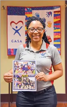  ?? STACI VANDAGRIFF/TRILAKES EDITION ?? The Tri-Lakes Court Appointed Special Advocates will host its first Superhero Fun Run on Sept. 22, starting at the Hot Springs Convention Center. Executive director Desternie Sullivan, who is posing with a flyer for the run, said she has had a passion for kids ever since she one.