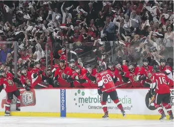  ?? TONY CALDWELL ?? The Ottawa Senators and their fans celebrate at Canadian Tire Centre on Tuesday after Mike Hoffman scored what would be the game-winning goal in Game 6 of the East final against the Pittsburgh Penguins.