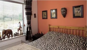  ??  ?? Above left Aengus calls this guest bedroom the African Room. It’s furnished with African prints and carved animals. ‘Before I met Terry, I travelled a lot in Gambia, Namibia and South Africa and I brought back all the artefacts, even the fabric for the...