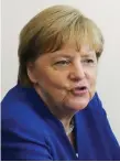  ??  ?? Struggling: German Chancellor Angela Merkel