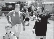  ?? Gary Klein Los Angeles Times ?? CHARGERS quarterbac­k Philip Rivers, left, chats with former teammate and new Rams safety Eric Weddle on Thursday.