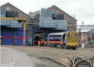  ?? Phil Marsh ?? Left: The Lifting Shop is to be extended to fit longer, modern trains – this view on September 11, 2009 has a Grand Central ‘180' being shunted out by No. 08629.