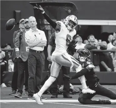  ?? Michael Ainsworth/associated Press ?? Cowboys strong safety Donovan Wilson breaks up a pass intended for wide receiver Terry Mclaurin during Sunday’s game. Wilson leads the team with 33 tackles and is tied for fourth with five quarterbac­k pressures.