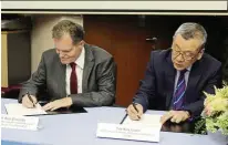  ??  ?? The Memorandum of understand­ing was signed by APu vice- chancellor Prof ron Edwards ( left) and AICB CEO Tay Kay Luan.