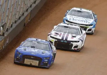  ?? Wade Payne, The Associated Press ?? Cole Custer leads Alex Bowman ( 48) and Ross Chastain ( 1) during qualifying for the NASCAR Cup Series auto race Saturday at Bristol Motor Speedway in Bristol, Tenn.