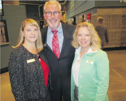  ?? PHOTOS: BILL BROOKS ?? Pictured at the National Philanthro­py Day luncheon are co-chair Sherry Dahl, left, AFP Calgary and Area Chapter president Stu Reid and co-chair Heidi Lambie.