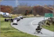  ?? THE ASSOCIATED PRESS ?? Emergency personnel respond to the scene Tuesday where a Pennsylvan­ia State Police corporal was shot in Northampto­n County, Pa. The corporal was shot several times while exchanging gunfire with a suspect during a traffic stop Tuesday morning, and the...