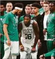  ?? Michael Dwyer / Associated Press ?? The Celtics’ Marcus Smart comes back onto the court after leaving temporaril­y with an injury during Game 3.