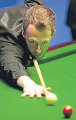  ?? PA. ?? Judd Trump at the table in his match against John Higgins.