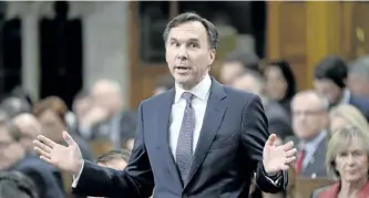  ?? ADRIAN WYLD/THE CANADIAN PRESS ?? Finance Minister Bill Morneau responds to a question during Wednesday in the House of Commons in Ottawa.