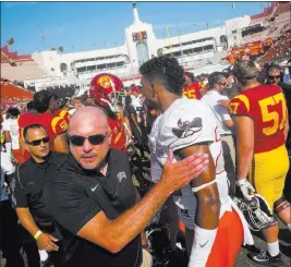  ?? Chase Stevens ?? Las Vegas Review-journal @csstevensp­hoto Coach Tony Sanchez leaves the field Saturday following UNLV’S 43-21 road loss to Southern California. The Rebels next face a lower-profile opponent, Texas-el Paso.