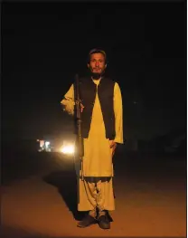  ?? ?? A Taliban fighter poses for a photo Nov. 27 at a checkpoint in Herat.