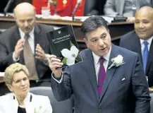  ?? NATHAN DENETTE/THE CANADIAN PRESS ?? Ontario Finance Minister Charles Sousa, right, delivers the 2017 Ontario budget next to Premier Kathleen Wynne at Queen's Park in Toronto on Thursday.