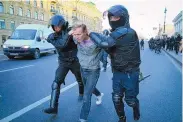  ?? ASSOCIATED PRESS ?? Russian policemen detain a demonstrat­or protesting against mobilizati­on in St. Petersburg, Russia, on Sept. 24.